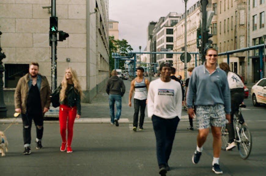 people waking through a passage