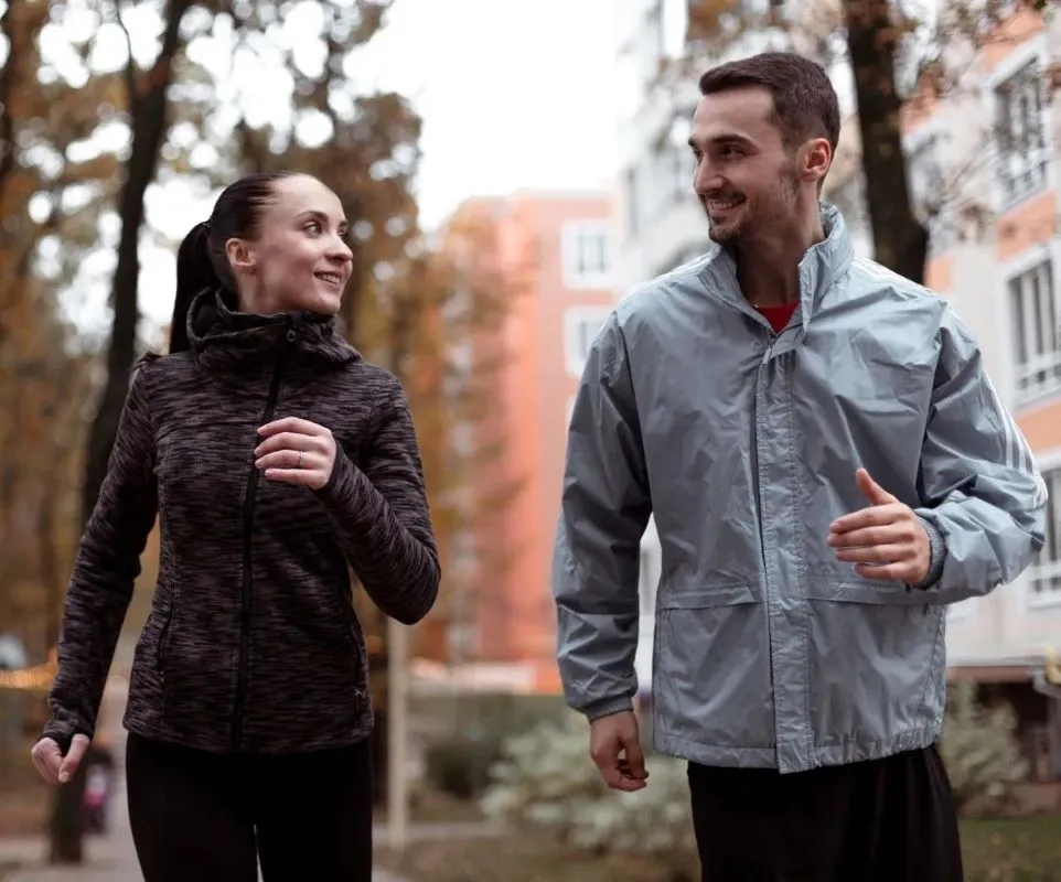 A Medium shot couple walking outdoors