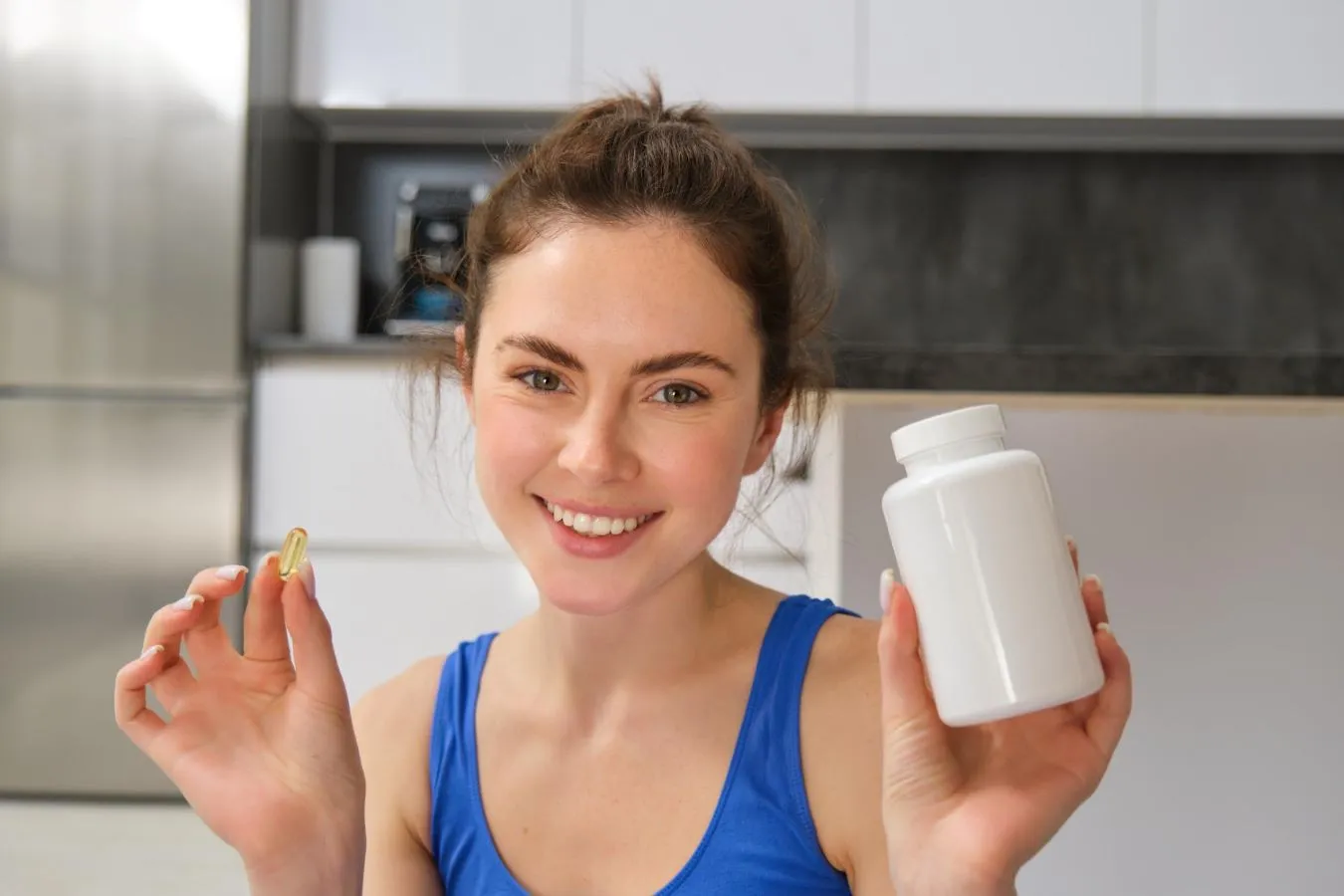 A girl holding collagen supplements