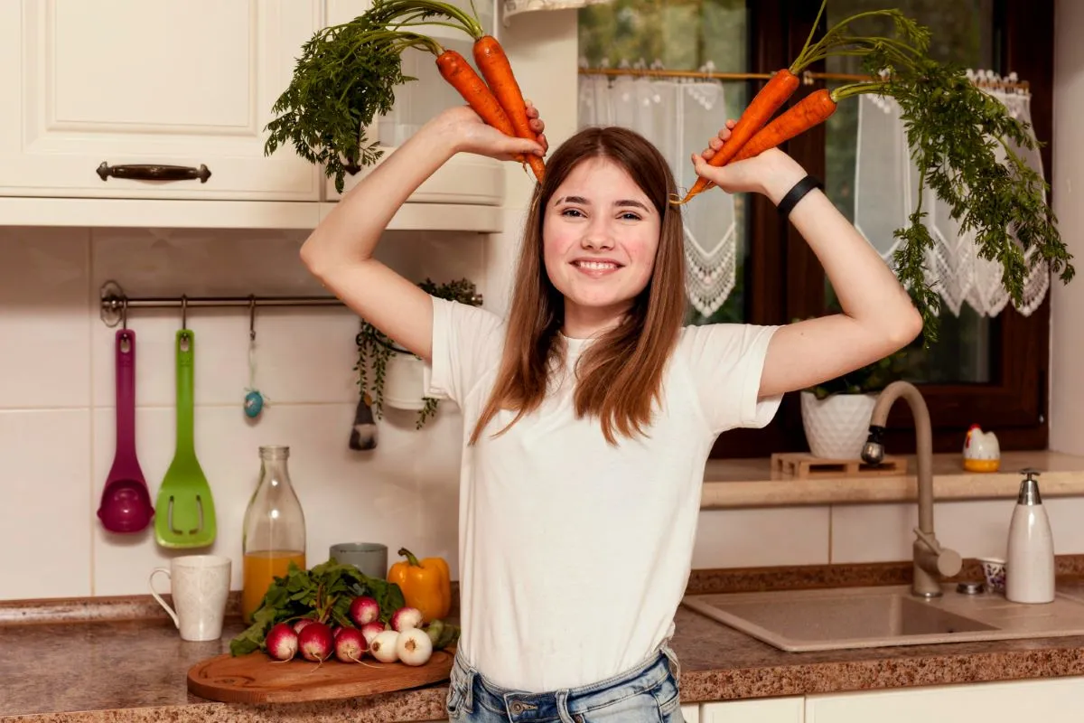 A woman expressing her joy holding carrots