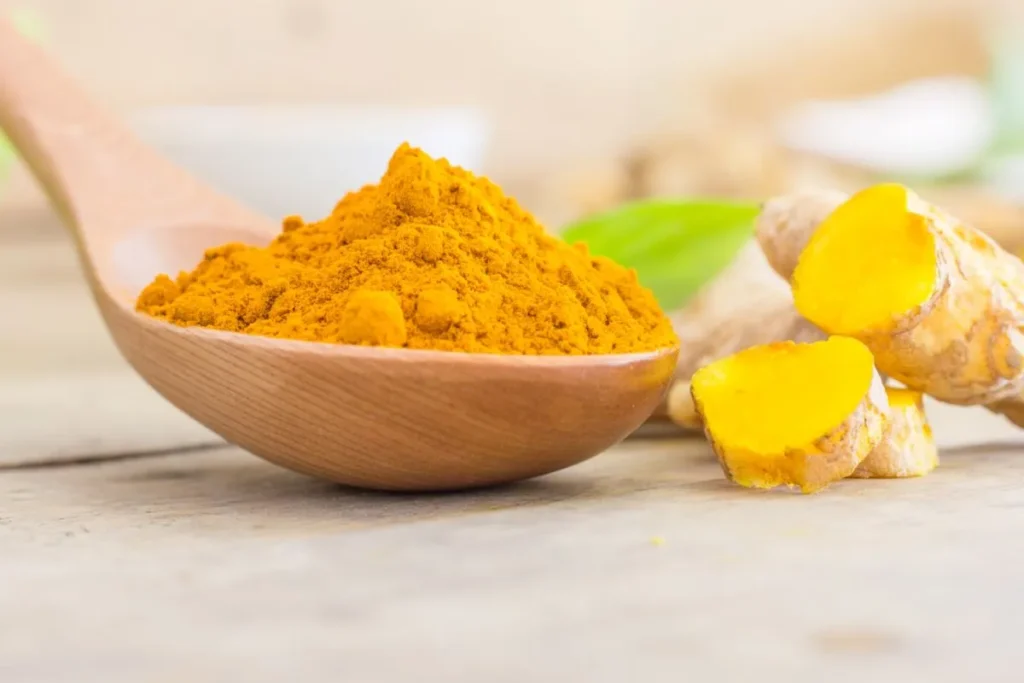 Turmeric in a wooden spoon